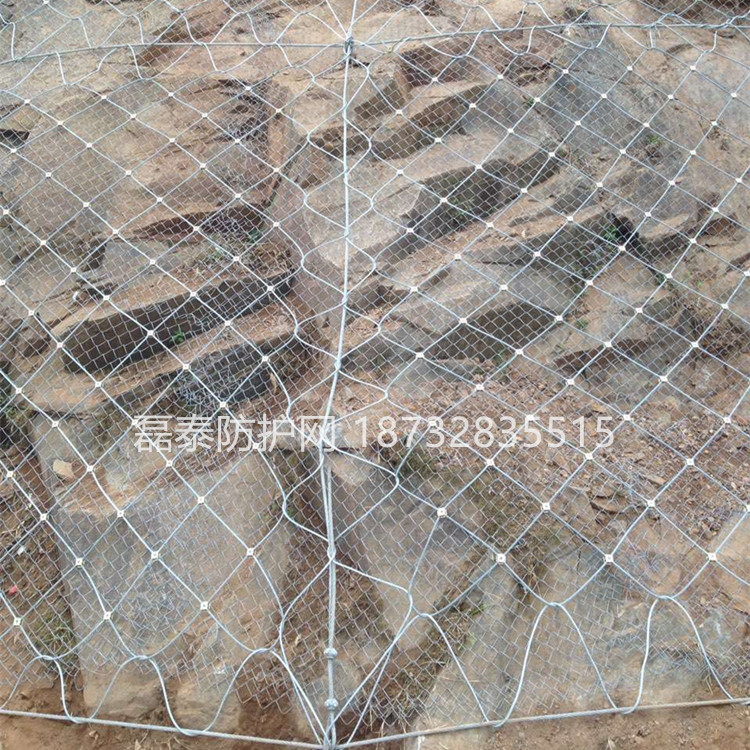 云南边坡防护网厂家和电话 钢丝绳护坡网 公路主动边坡防护网图片
