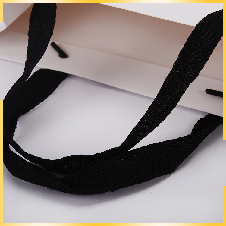专业定制白色手提服装纸袋批发各种规格服装包装纸袋定制手提纸袋图片