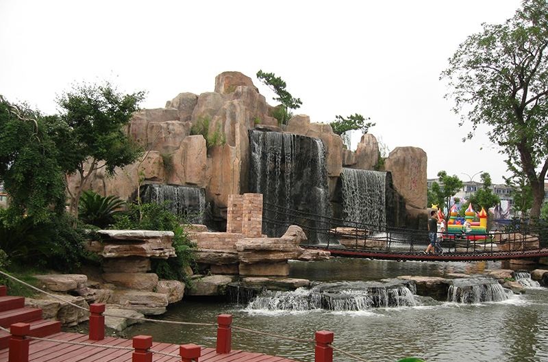 重庆市公园水泥塑石假山跌水景观设计规划厂家公园水泥塑石假山跌水景观设计规划