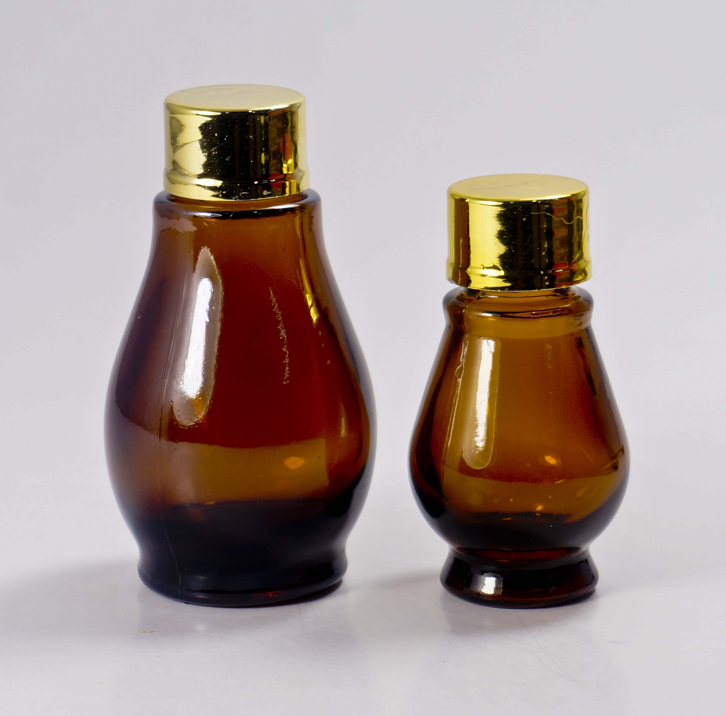 正供应茶色双葫芦药油玻璃瓶批发 葫芦玻璃瓶批发彩色精油瓶订做图片